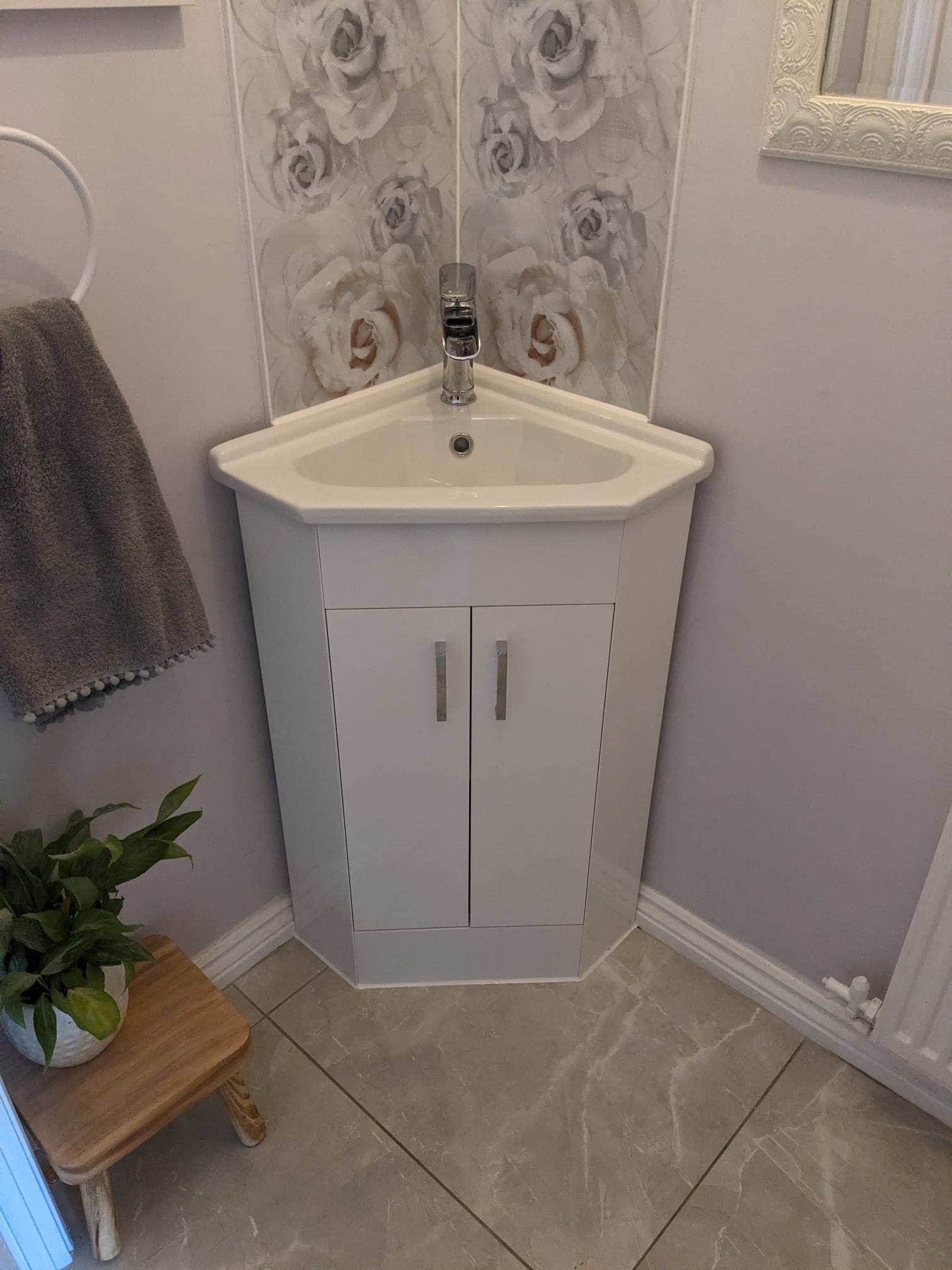 Corner bathroom vanity unit fitted in place
